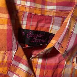 Cowgirl Legend Women's Pink and Orange Plaid Pearl Snap Western Shirt